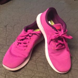Pink Nike running tennis shoes